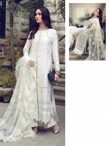 You Will Definitely Earn Lots Of Compliments Wearing This Designer Floor Length Suit In Creem Color. Its Pretty Top Is Cotton Based Paired With Cotton Bottom And Net Fabricated Dupatta. Its Pretty Color And Pattern Will Give You A Look Like Never Before.