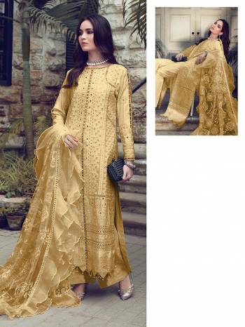 You Will Definitely Earn Lots Of Compliments Wearing This Designer Floor Length Suit In Golden Color. Its Pretty Top Is Cotton Based Paired With Cotton Bottom And Net Fabricated Dupatta. Its Pretty Color And Pattern Will Give You A Look Like Never Before.