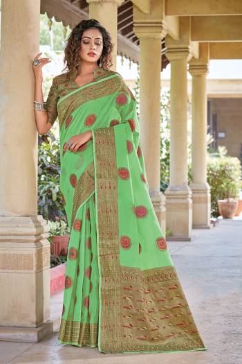 Adorn The Pretty Angelic Look Wearing This Heavy Designer Wevon Saree In Sea Green Color Paired With Blouse. This Saree Is Fabricated On Cotton Handloom Paired With Blouse. Its Pretty Color Pallete Will Give An Attractive Look To Your Personality. 