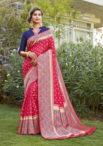 Grab This Pretty Elegant Looking Designer Saree In Pink Color Paired With Contrasting Blue Colored Blouse. This Saree And Blouse Are Silk Based Beautified With Heavy Wevon Border Pallu With Sirki Work. Buy Now.