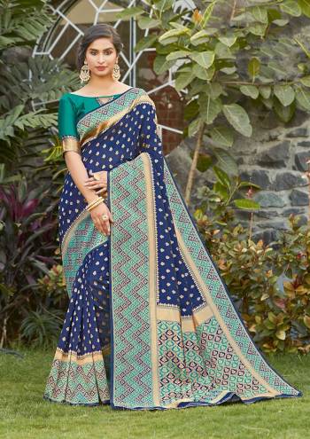 Grab This Pretty Elegant Looking Designer Saree In Blue Color Paired With Contrasting Green Colored Blouse. This Saree And Blouse Are Silk Based Beautified With Heavy Wevon Border Pallu With Sirki Work. Buy Now.