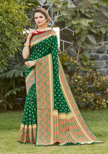 Grab This Pretty Elegant Looking Designer Saree In Green Color Paired With Contrasting Red Colored Blouse. This Saree And Blouse Are Silk Based Beautified With Heavy Wevon Border Pallu With Sirki Work. Buy Now.