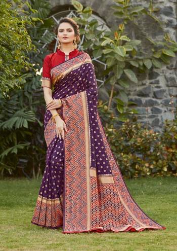 Grab This Pretty Elegant Looking Designer Saree In Voilet Color Paired With Contrasting Red Colored Blouse. This Saree And Blouse Are Silk Based Beautified With Heavy Wevon Border Pallu With Sirki Work. Buy Now.