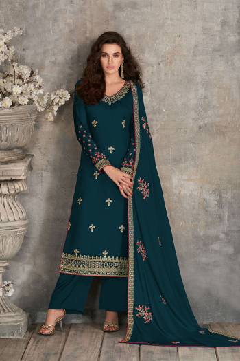 Rich And Elegant Looking Pakistani Style Straight Suits Is Here In Aqua Blue Color. Its Blouse,  Top And Dupatta Are Fabricated On Rangoli Georgette Based Paired With Santoon Fabricated Bottom With Heavy Embroidery Work.