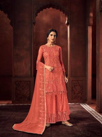 Look Pretty In This Beautiful Designer Floor Length Dress In Peach Color Paired With Dupatta. This Semi-Stitched Dress Are Fabricated On Net Beautified With Pretty Embroidery. Buy Now