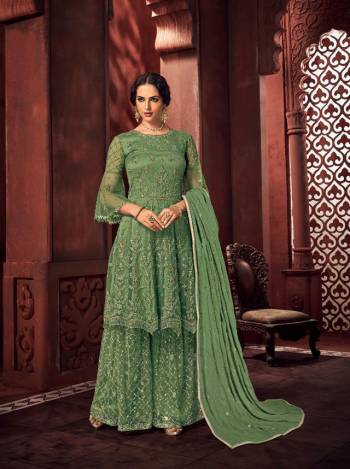 Look Pretty In This Beautiful Designer Floor Length Dress In Green Color Paired With Dupatta. This Semi-Stitched Dress Are Fabricated On Net Beautified With Pretty Embroidery. Buy Now