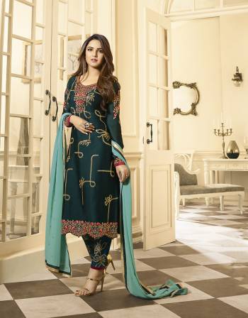 Get Ready For The Upcoming Festive And Wedding Season With This Heavy Designer Straight Suit In All Over Fine Color. Its Heavy Embroidered And Diamond Work Top Fabricated On Satin Georgette And Dupatta are Fabricated On Rangoli Paired With Dull Santoon Fabricated Bottom. Its Giving A More Enhnaced And Attractive Look.