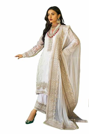 Grab This Pretty Heavy Embroidered Pakistani Designer Salwar Kameez In Creem Color. Its Embroidered Top Is Faux Georgette Based Paired With Santoon Bottom and Nazneen Fabricated Embroidered Dupatta.