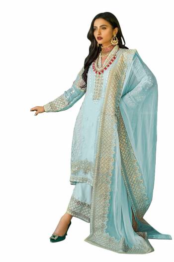 Grab This Pretty Heavy Embroidered Pakistani Designer Salwar kameez In Blue Color. Its Embroidered Top Is Faux Georgette Based Paired With Santoon Bottom and Nazneen Fabricated Embroidered Dupatta.