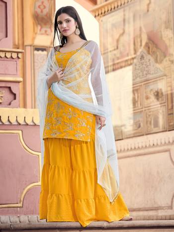 Rich And Elegant Looking Straight Suits Is Here In Musterd Color. Its Top And Bottom Are Fabricated On Crape Based Paired With Art Silk Fabricated Dupatta With Heavy Jari And Sequance Embroidery Work.