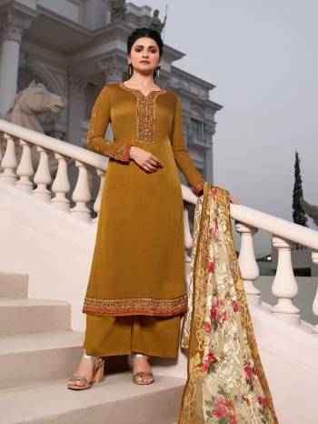 Here Is A Very Pretty Designer Straight Suit In Golden Color. Its Embroidered Top and Bottom Are Fabricated On Tusser Satin Paired with Brasso With Digital Print Fabricated Dupatta. Its Fabrics Are Soft Towards Skin And Esnures Superb Comfort All Day Long