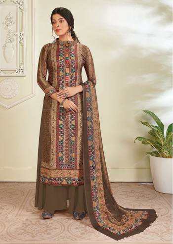 Your Rich And Elegant Taste In This Lovely Designer Straight suit In Dusty Color. Its Top Is Pashmina Based Paired With Pashmina Solid Bottom And Chiffon Dupatta. It Has Elegant Hand Work With Digital Print.