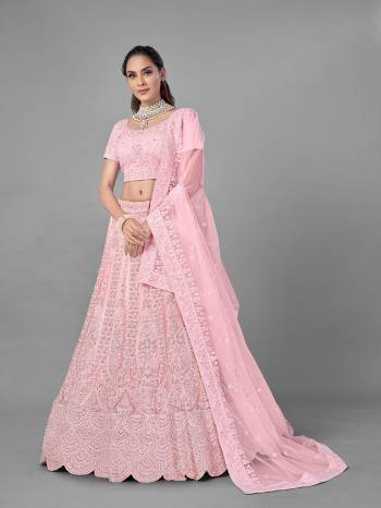 Look Pretty In This Beautiful Heavy Designer Lehenga Choli Is Light Color. This Attractive Embroidered Lehenga Choli Is Fabricated On Soft Net Paired With Soft Net Fabricated Dupatta. It Is Light In Weight And Easy To Carry All Day Long.