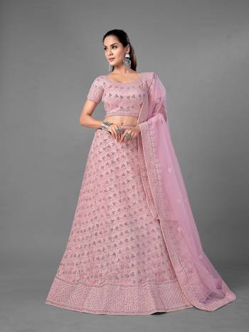 Look Pretty In This Beautiful Heavy Designer Lehenga Choli Is Light Color. This Attractive Embroidered Lehenga Choli Is Fabricated On Soft Net Paired With Soft Net Fabricated Dupatta. It Is Light In Weight And Easy To Carry All Day Long.