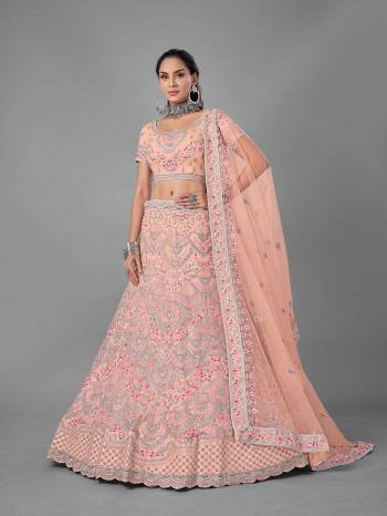 Look Pretty In This Beautiful Heavy Designer Lehenga Choli Is Light Color. This Attractive Embroidered Lehenga Choli Is Fabricated On Soft Net Paired With Soft Net Fabricated Dupatta. It Is Light In Weight And Easy To Carry All Day Long.