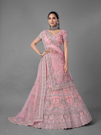 Look Pretty In This Beautiful Heavy Designer Lehenga Choli Is Light Color. This Attractive Embroidered Lehenga Choli Is Fabricated On Soft Net Paired With Soft Net Fabricated Dupatta. It Is Light In Weight And Easy To Carry All Day Long.