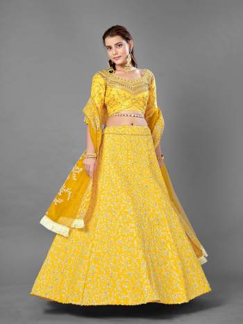 Evergreen Combination Is Here With This Heavy Designer Lehenga Choli In Yellow Color. Its Blouse And Lehenga Are Fabricated On Art Silk Paired With Soft Net Fabricated Dupatta. Buy Now