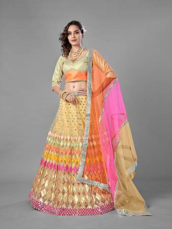 Evergreen Combination Is Here With This Heavy Designer Lehenga Choli In Beige Color. Its Blouse And Lehenga Are Fabricated On Soft Net Paired With Soft Net Fabricated Dupatta. Buy Now