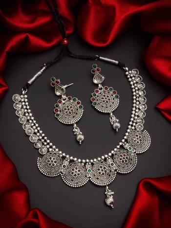 Give An Enhanced Look To Your Personality By Pairing Up This Beautiful Necklace Set With Your Ethnic Attire. This Pretty Set Is In Silver Color Beautified With Temple. Buy Now.