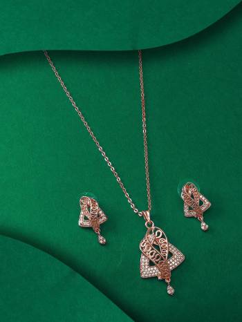 Give An Enhanced Look To Your Personality By Pairing Up This Beautiful Pendent Set With Your Ethnic Attire. This Pretty Set Is In Rose Gold Color Beautified With American Diamond Work. Buy Now.