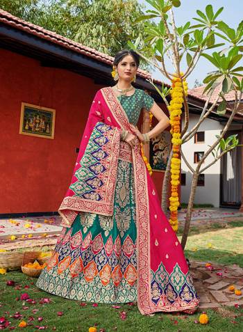 Look Pretty In This Designer Silk Based Lehenga Choli In Rama Color Paired With Contrasting Pink Colored Dupatta. It Is Fabricated On Banarasi Jacquard Silk Beautified With Weave All Over. Buy This Pretty Piece Now.? 