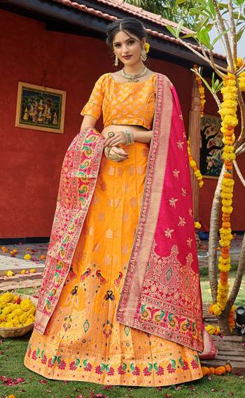 Look Pretty In This Designer Silk Based Lehenga Choli In Musterd Color Paired With Contrasting Pink Colored Dupatta. It Is Fabricated On Banarasi Jacquard Silk Beautified With Weave All Over. Buy This Pretty Piece Now.? 