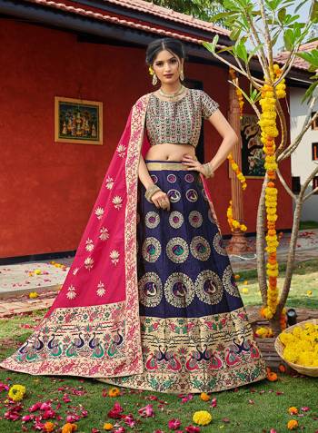 Look Pretty In This Designer Silk Based Lehenga Choli In Nevy Blue Color Paired With Contrasting Pink Colored Dupatta. It Is Fabricated On Banarasi Jacquard Silk Beautified With Weave All Over. Buy This Pretty Piece Now.? 