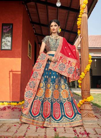 Look Pretty In This Designer Silk Based Lehenga Choli In Blue Color Paired With Contrasting Red Colored Dupatta. It Is Fabricated On Banarasi Jacquard Silk Beautified With Weave All Over. Buy This Pretty Piece Now.? 