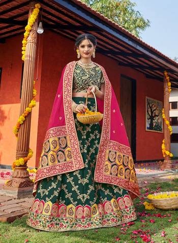 Look Pretty In This Designer Silk Based Lehenga Choli In Green Color Paired With Contrasting Pink Colored Dupatta. It Is Fabricated On Banarasi Jacquard Silk Beautified With Weave All Over. Buy This Pretty Piece Now.? 