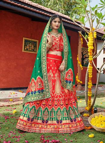 Look Pretty In This Designer Silk Based Lehenga Choli In Tamato Color Paired With Contrasting Green Colored Dupatta. It Is Fabricated On Banarasi Jacquard Silk Beautified With Weave All Over. Buy This Pretty Piece Now.? 