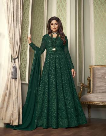 You Will Definitely Earn Lots Of Compliments Wearing This Lovely Floor Length Heavy Designer Embroidery Work Suit In Fine Dark Color. Its Top Is Fabricated On Gergette paired With Santoon Bottom And Georgette Fabricated Dupatta.