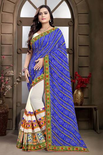 Adorn The Pretty Angelic Look Wearing This Heavy Designer Saree In Nevy Blue Color Paired With Contrasting White Colored Blouse. This Saree Is Fabricated On Georgette Paired With Art Silk Fabricated Blouse. Its Pretty Color Pallete Will Give An Attractive Look To Your Personality. 