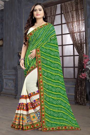 Adorn The Pretty Angelic Look Wearing This Heavy Designer Saree In Green Color Paired With Contrasting White Colored Blouse. This Saree Is Fabricated On Georgette Paired With Art Silk Fabricated Blouse. Its Pretty Color Pallete Will Give An Attractive Look To Your Personality. 