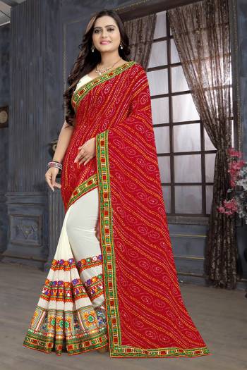 Adorn The Pretty Angelic Look Wearing This Heavy Designer Saree In Red Color Paired With Contrasting White Colored Blouse. This Saree Is Fabricated On Georgette Paired With Art Silk Fabricated Blouse. Its Pretty Color Pallete Will Give An Attractive Look To Your Personality. 