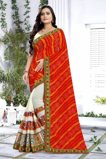 Adorn The Pretty Angelic Look Wearing This Heavy Designer Saree In Orange Color Paired With Contrasting White Colored Blouse. This Saree Is Fabricated On Georgette Paired With Art Silk Fabricated Blouse. Its Pretty Color Pallete Will Give An Attractive Look To Your Personality. 