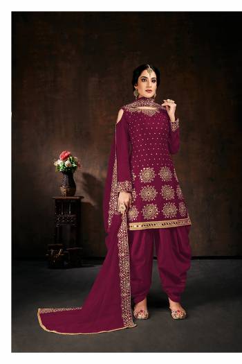 Here Is An Attractive Looking Mirror Embroidered Heavy Designer Suit In Burgundy Color Paired With Dupatta. Its Top Is Fabricated On Faux Georgette Paired With Santoon Bottom And Net Fabricated Dupatta. Also, Its Dupatta Is Beautified With Embroidered Lace Border.