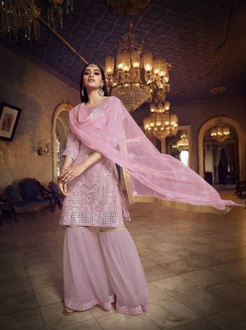 Get Ready For The Upcoming Festive And Wedding Season Wearing This Heavy Designer Embroidery With Foil Mirror Work Sharara Suit In Light Color. Its Top Are Fabricated Organza And Bottom And Dupatta Are Fabricated on Soft Net. Buy Now.