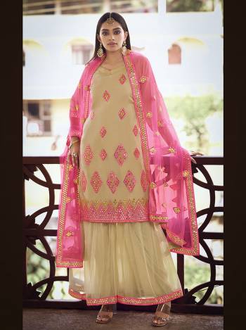 Get Ready For The Upcoming Festive And Wedding Season Wearing This Heavy Designer Embroidery With Foil Mirror Work Sharara Suit In Light Color. Its Top Are Fabricated Organza And Bottom And Dupatta Are Fabricated on Soft Net. Buy Now.