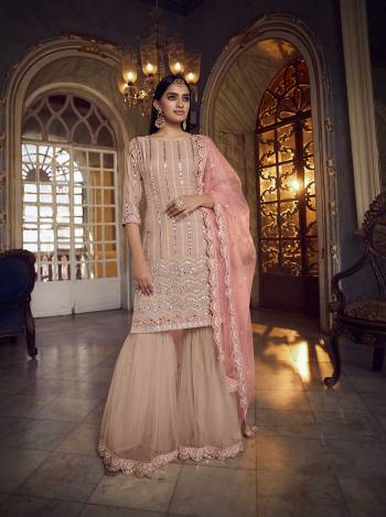 Get Ready For The Upcoming Festive And Wedding Season Wearing This Heavy Designer Embroidery With Foil Mirror Work Sharara Suit In Light Color. Its Top Are Fabricated Organza And Bottom And Dupatta Are Fabricated on Soft Net. Buy Now.