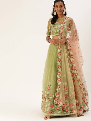 Evergreen Combination Is Here With This Heavy Designer Lehenga Choli In Light Color. Its Blouse And Lehenga Are Fabricated On Net Paired With Net Fabricated Dupatta. Buy Now