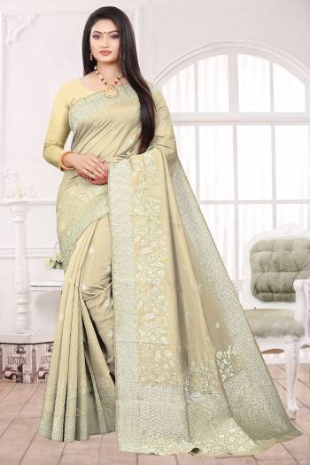 Adorn The Pretty Angelic Look Wearing This Heavy Designer Wevon Saree In Beige Color Paired With Blouse. This Saree Is Fabricated On Soft Art Silk Paired With Art Silk Fabricated Blouse. Its Pretty Color Pallete Will Give An Attractive Look To Your Personality. 