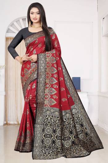 Look Attractive Wearing This Maroon Colored Saree Paired With Black Colored Blouse.  This Heavy Wevon Designer Saree Is Soft Litchi Silk Based Which Gives A Rich Look To Your Personality. Buy This Pretty Saree Now.