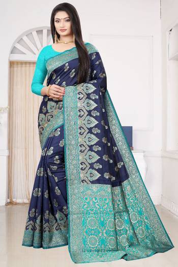 Look Attractive Wearing This Nevy Blue Colored Saree Paired With Blue Colored Blouse.  This Heavy Wevon Designer Saree Is Soft Litchi Silk Based Which Gives A Rich Look To Your Personality. Buy This Pretty Saree Now.