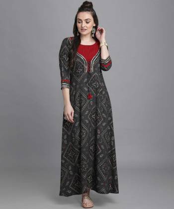 Add This Pretty Readymade Long Kurti To Your Wardrobe In Grey Color. This Kurti Is Fabricated On Rayon Beautified With Bandhni Foil Print With Key Hole Neck.