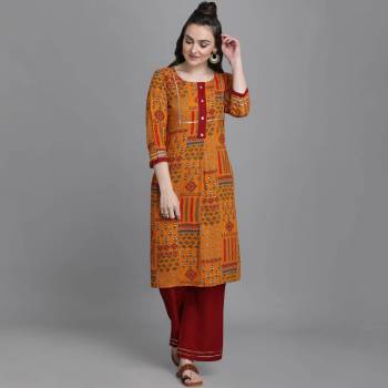 Simple and Elegant Looking Readymade Pair Of Kurti And Plazzo Is Here In Musterd Color, This Pretty Pair Is Fabricated On Rayon Beautified With Prints, Also It Is Available In All Regular Sizes.