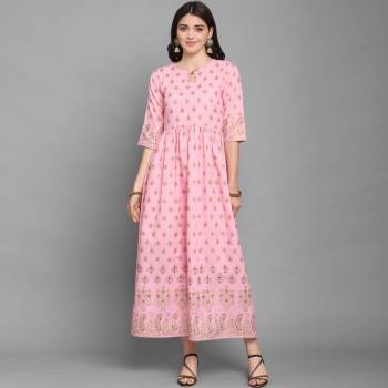 For Your Semi-Casuals, Grab This Designer Readymade Long Kurti In Pink Color Fabricated On Ruby Cotton. It Is Beautified With Foil Prints And You Can Pair This Up With Some Accessories For A Festive Look. Buy Now.