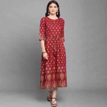 For Your Semi-Casuals, Grab This Designer Readymade Long Kurti In Maroon Color Fabricated On Ruby Cotton. It Is Beautified With Foil Prints And You Can Pair This Up With Some Accessories For A Festive Look. Buy Now.