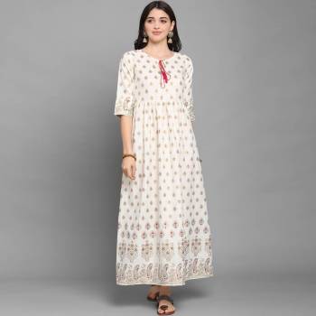 For Your Semi-Casuals, Grab This Designer Readymade Long Kurti In White Color Fabricated On Ruby Cotton. It Is Beautified With Foil Prints And You Can Pair This Up With Some Accessories For A Festive Look. Buy Now.