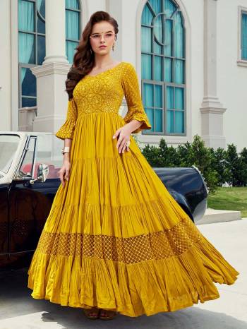 Look Pretty In This Beautiful Readymade Designer Floor Length Gown In Yellow Color Paired With Blue Colored Dupatta. This Stitched Gown Are Viscose & Maslin Silk And Dupatta Are Fabricated On Soft Net Beautified With Pretty Embroidery. Buy Now.