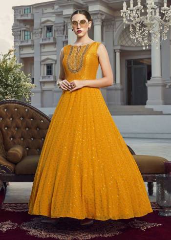 Look Pretty In This Beautiful Readymade Designer Floor Length Gown In Musterd Color Paired With Blue Colored Dupatta. This Stitched Gown Are Viscose Georgette And Dupatta Are Fabricated On Soft Net Beautified With Pretty Embroidery. Buy Now.